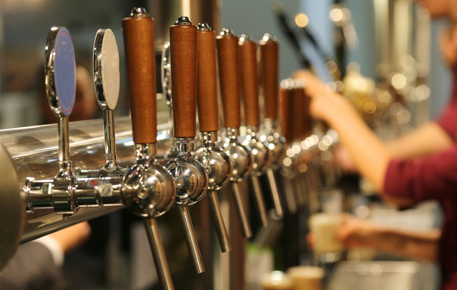 Row of beer taps in a traditional pub banner image